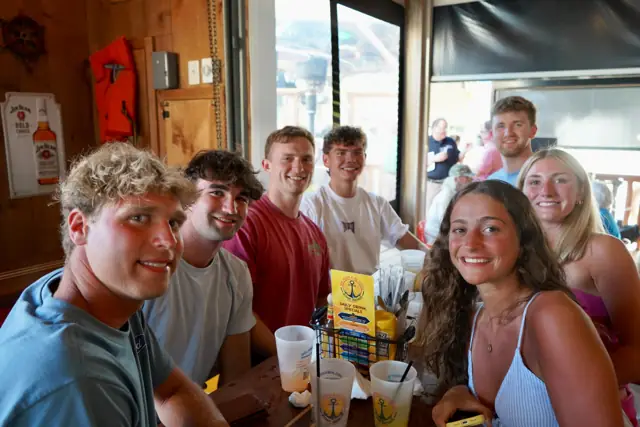 A group of college friends around a table