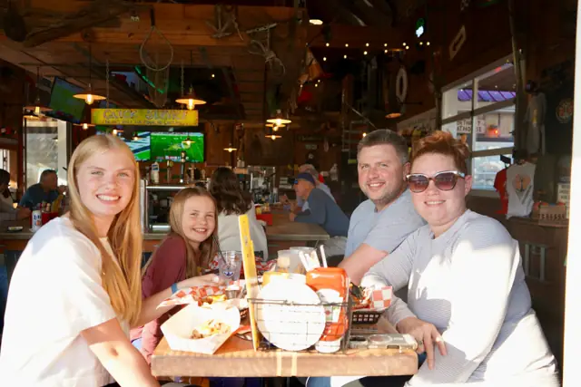 A family having dinner inside the Boathouse